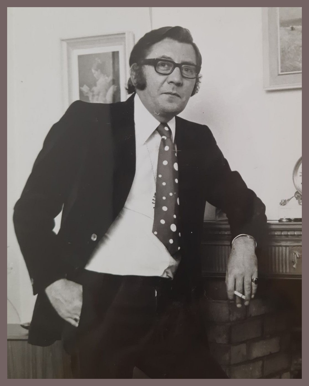 James Beck In front of fireplace